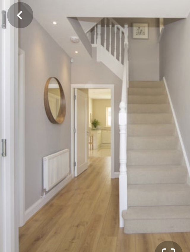 the stairs in this house are white and wood