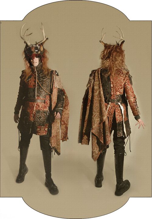 two dolls dressed in costumes with horns and furs