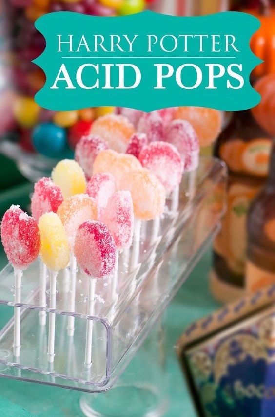 harry potter acid pops are on display in front of other candy and candies at an event