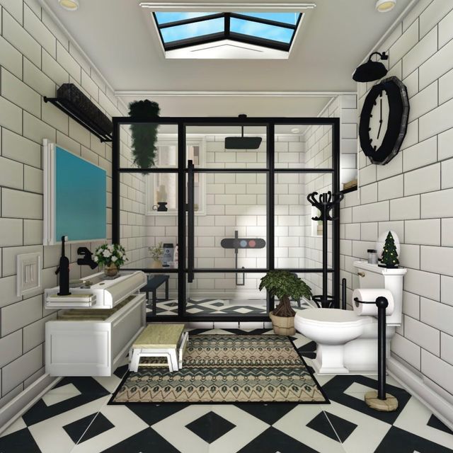 this bathroom has black and white tiles on the floor, walls, and ceilinging