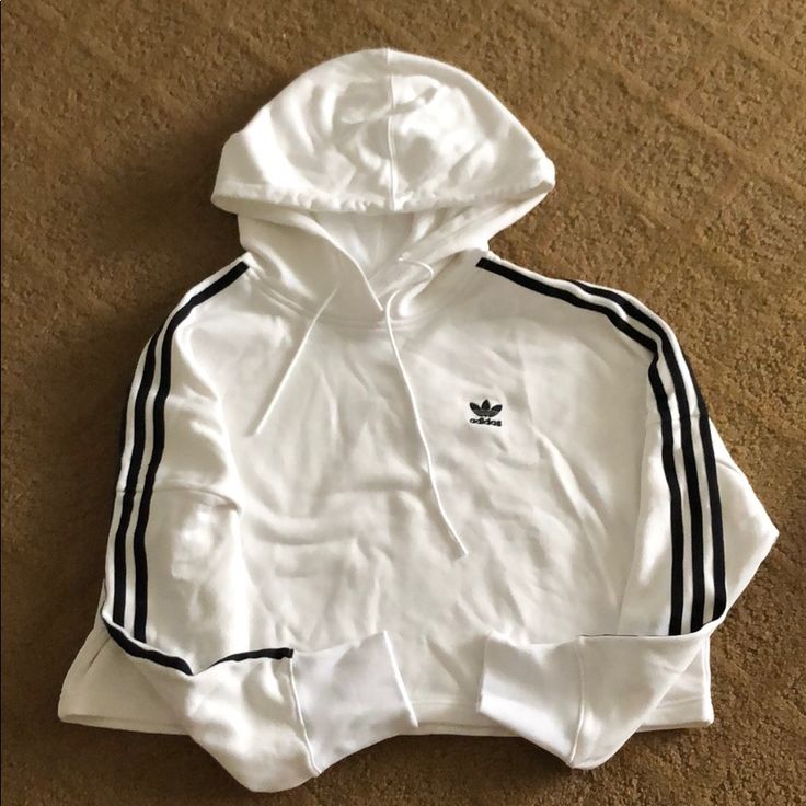 Cropped Hoodie 3 Striped Along Both Sleeves Great Condition Never Worn Adidas Sporty Hoodie With Ribbed Cuffs, Adidas Sportswear Hoodie With Three Stripes, Adidas Casual Sweatshirt With Three Stripes, Casual Adidas Sweatshirt With Three Stripes, Sporty Cotton Adidas Sweatshirt, Adidas Cotton Athleisure Hoodie, Casual Adidas Hoodie With Three Stripes, White Sporty Sweatshirt With Ribbed Cuffs, Trendy White Hoodie With Ribbed Cuffs