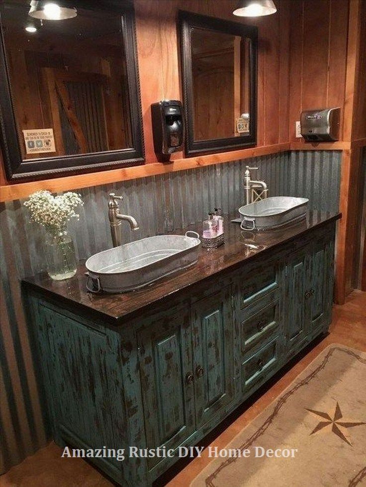 a bathroom with two sinks and mirrors on the wall