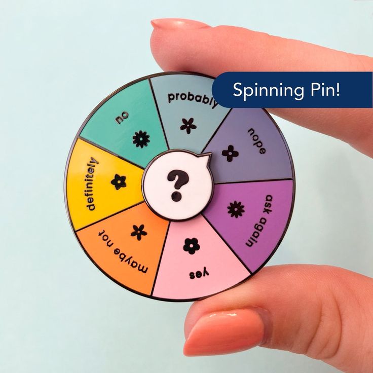 a hand holding a spinning wheel with words on it that spell out what you're doing