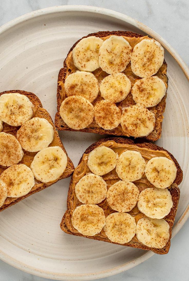 three slices of toast with bananas on them