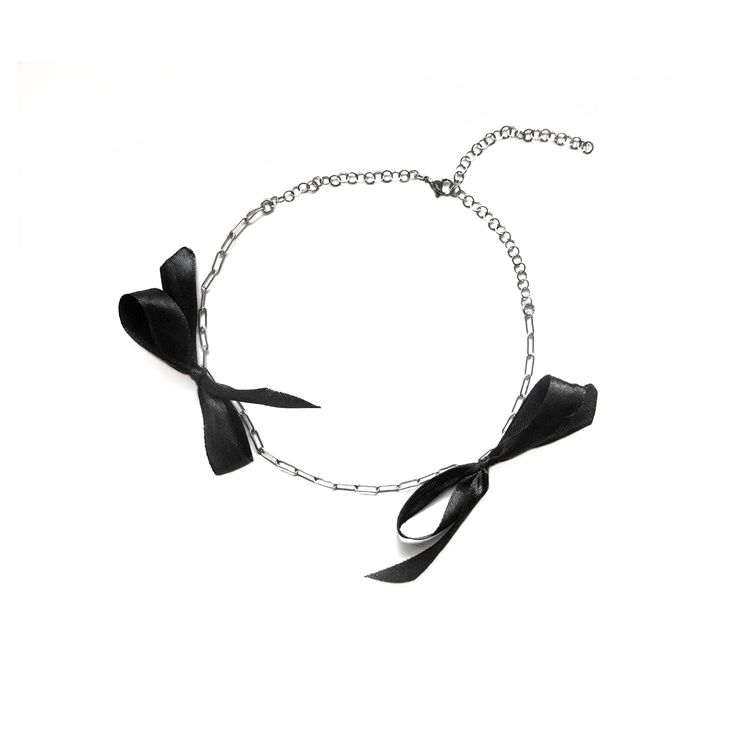 -Stainless Steel, Black Ribbon -Adjustable, Fits Circumference from 12″ - 16″ (30cm - 40.6cm) ▶ Ready to Ship on MAY 6TH ---- Black Bow Choker Necklace ---- The Black Bow Choker Necklace is an elegant piece that brings a touch of sophistication. Featuring two black ribbon bows, it radiates a polished appeal that is both classic and adaptable. Great for a special occasion and your everyday look. Made from lightweight stainless steel, it offers durability without compromising on comfort. The adjustable chain at the back ensures a perfect fit for every wearer. - 2404 Collection  MATERIAL Stainless Steel, Black Ribbon  SIZE Adjustable - Fits Circumference from 12″ - 16″ (30cm - 40.6cm)  SUGGESTED CARE: Use water and a drop of mild detergent. Rinse, then line dry. Always make sure to wipe off w Chic Ribbon Necklace Perfect For Gifts, Bow Choker, Elegant Choker, Bow Necklace, Perfect Partner, Elegant Necklace, Wedding Jewellery Necklace, Timeless Gifts, Necklace Black