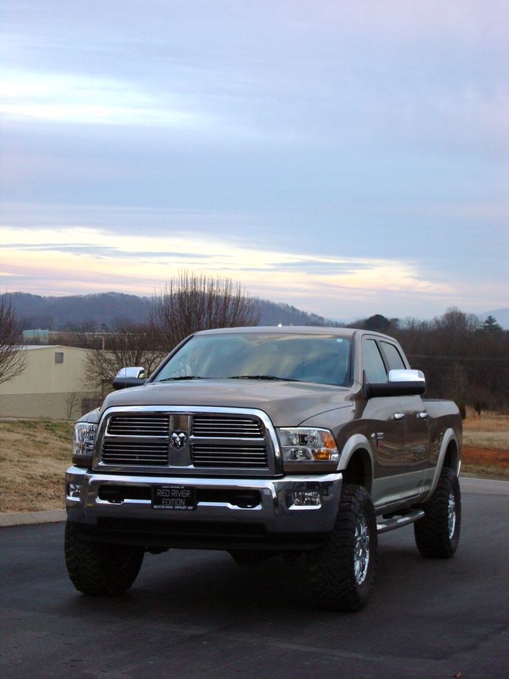 a large gray truck parked in a parking lot