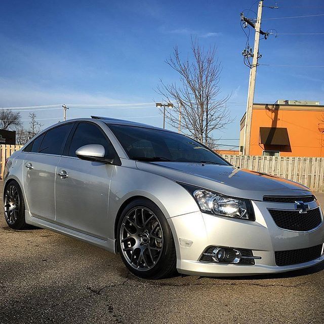 a silver car parked in a parking lot