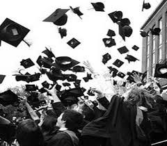 black and white photograph of graduates throwing their caps in the air with text that reads, you're time is coming soon keep holding on