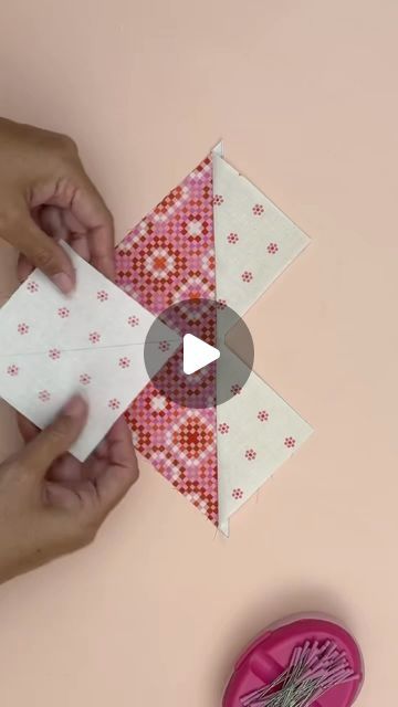 someone is making a paper origami star