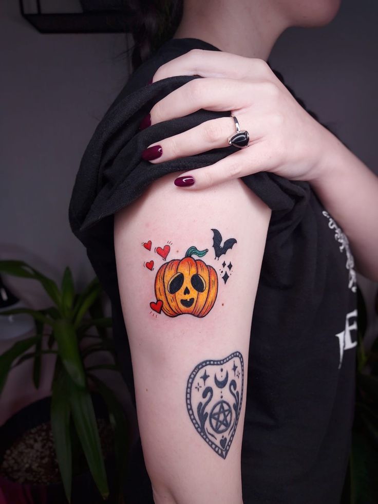 a woman with a pumpkin tattoo on her arm