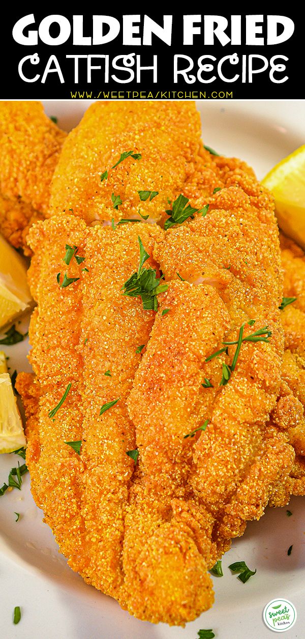 the golden fried fish is served with lemon wedges and garnished with parsley