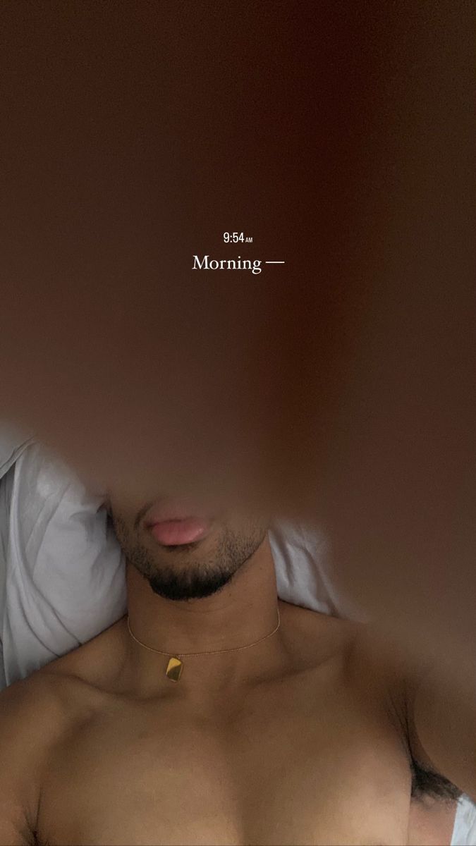 a shirtless man laying in bed with his head turned to the side and text above him