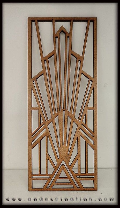 an art deco sculpture made out of wood with geometric designs on the front and sides