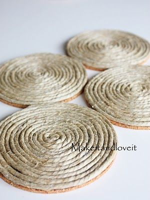 four cookies are arranged in the shape of spirals on a white tablecloth background