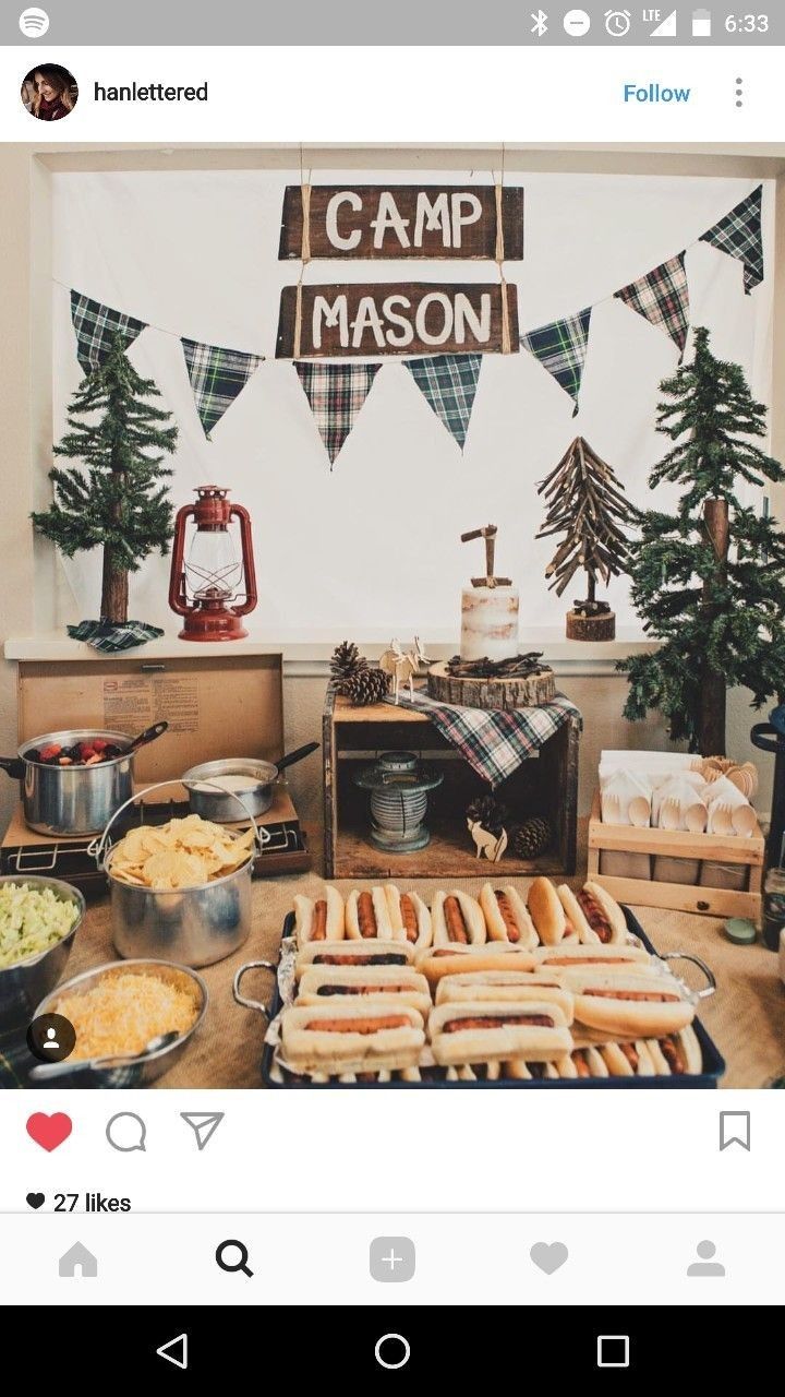 a table filled with hot dogs and other foods