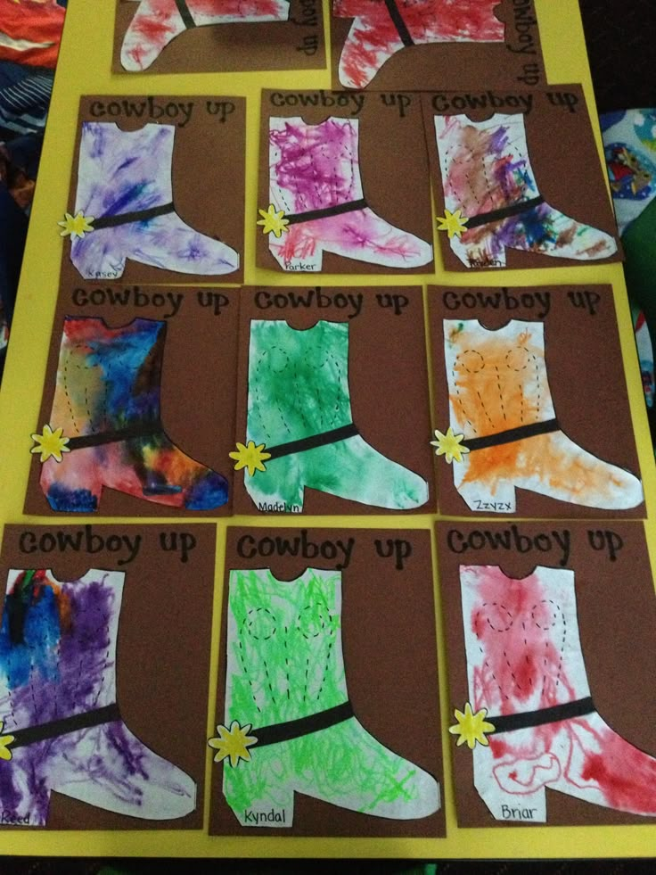 paper cut out of different colored socks on a table