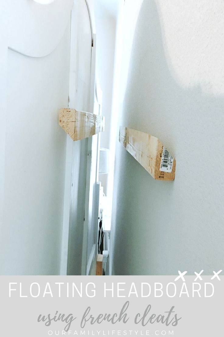 a narrow hallway leading to a white door with text overlay reading floating headboard using french cleats