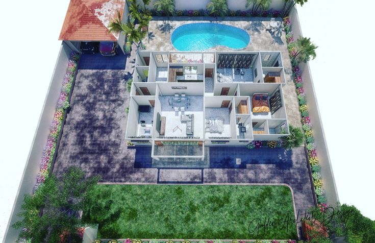 an aerial view of a house with a pool in the middle and landscaping around it