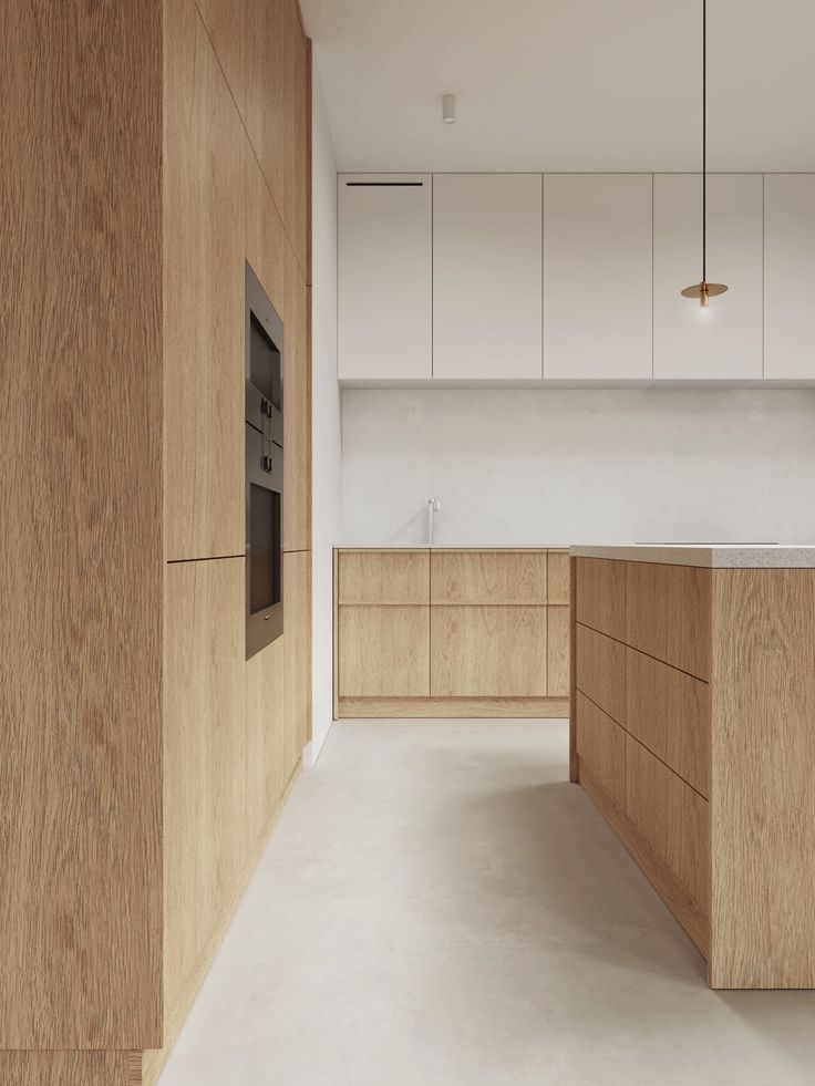 an empty kitchen with wooden cabinets and counter tops