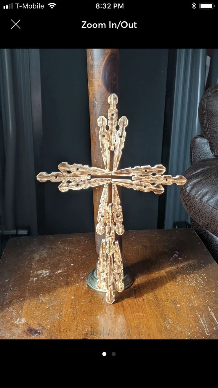 a wooden cross sitting on top of a table