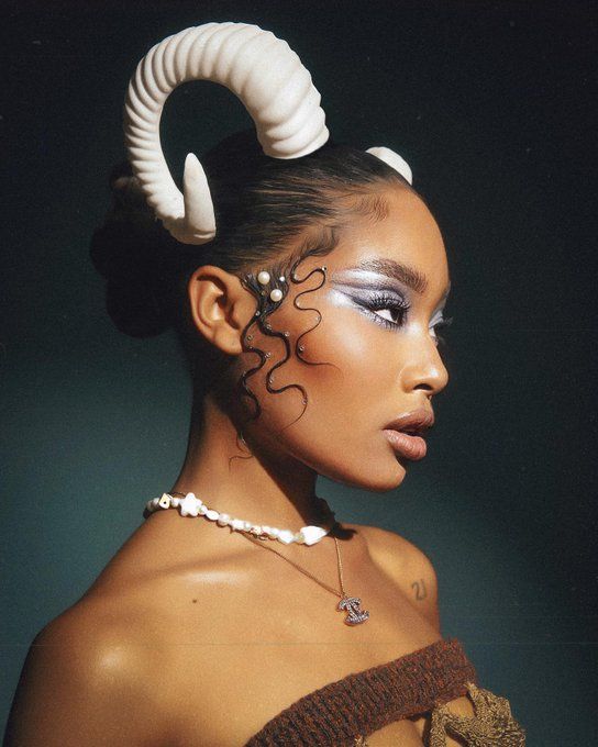 a woman with horns painted on her face