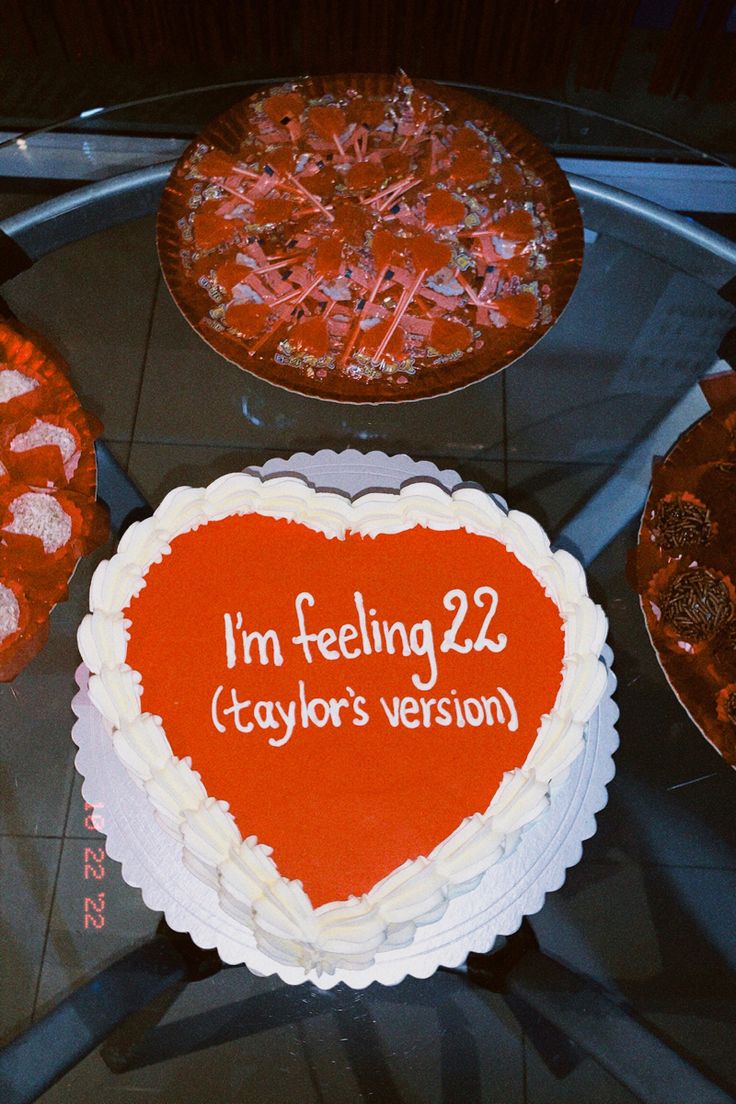 a heart shaped cake with the words i'm feeling 22 caylors version written on it