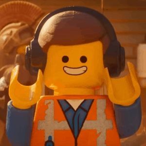 the lego movie character is wearing headphones and an orange vest with ear muffs