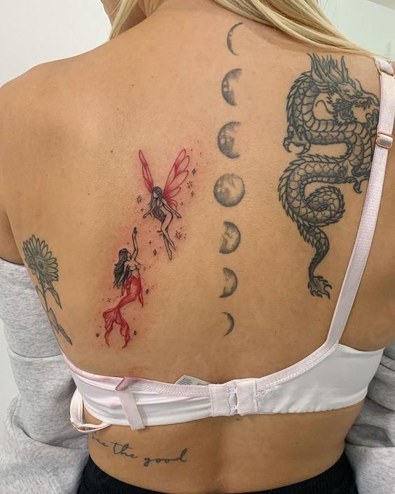 a woman with tattoos on her back