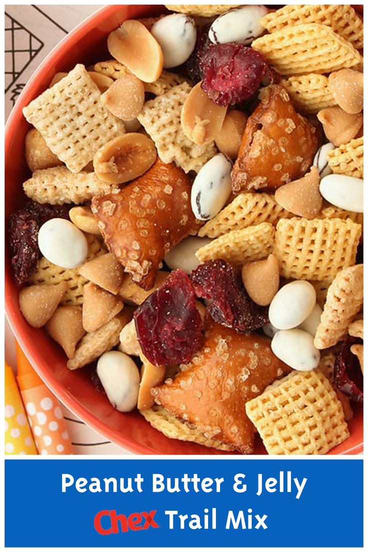 a bowl filled with peanut butter and jelly chex trail mix on top of a table