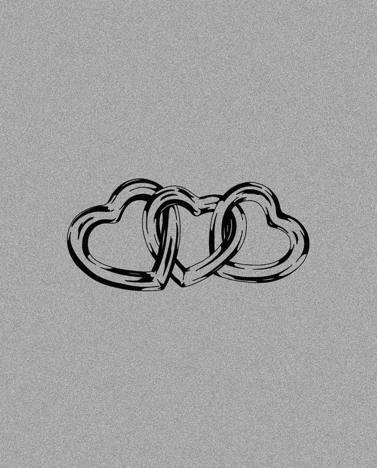 two interlocked hearts on a gray background