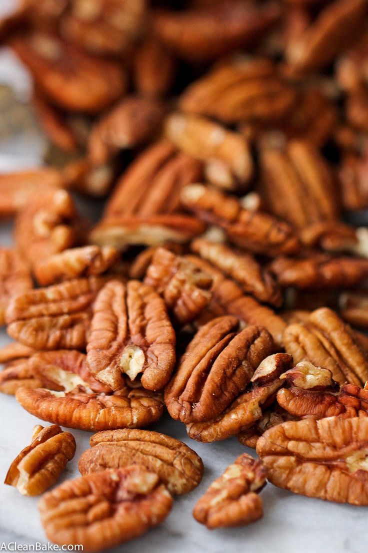 pecans scattered on top of each other in a pile