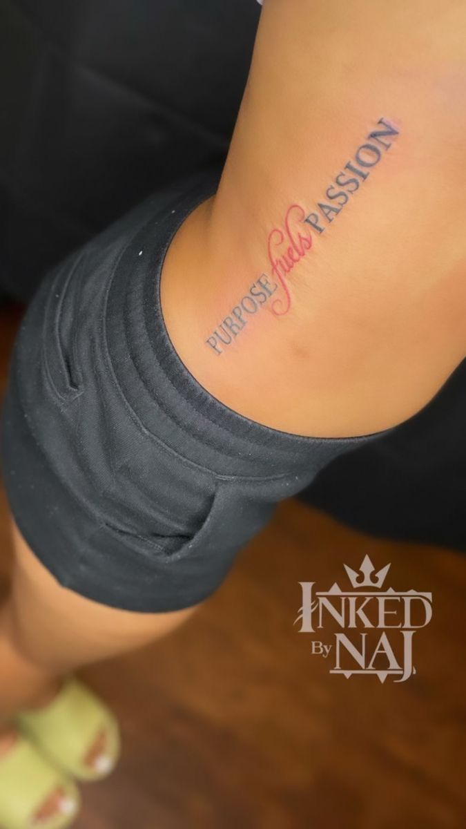 a woman with a tattoo on her lower back and the words, purpose is passion written in cursive font