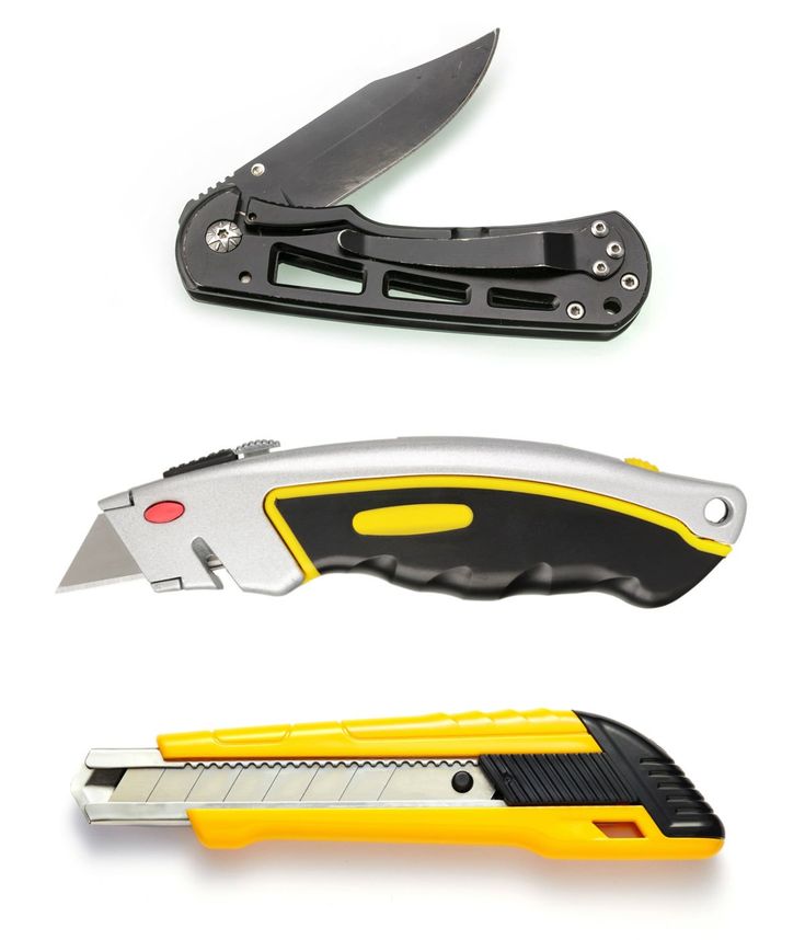 three different types of knifes with yellow handles and black blades, one has an open blade