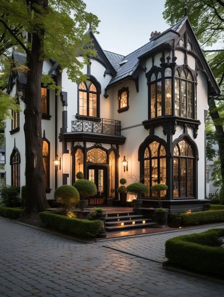 a white and black house with lots of windows