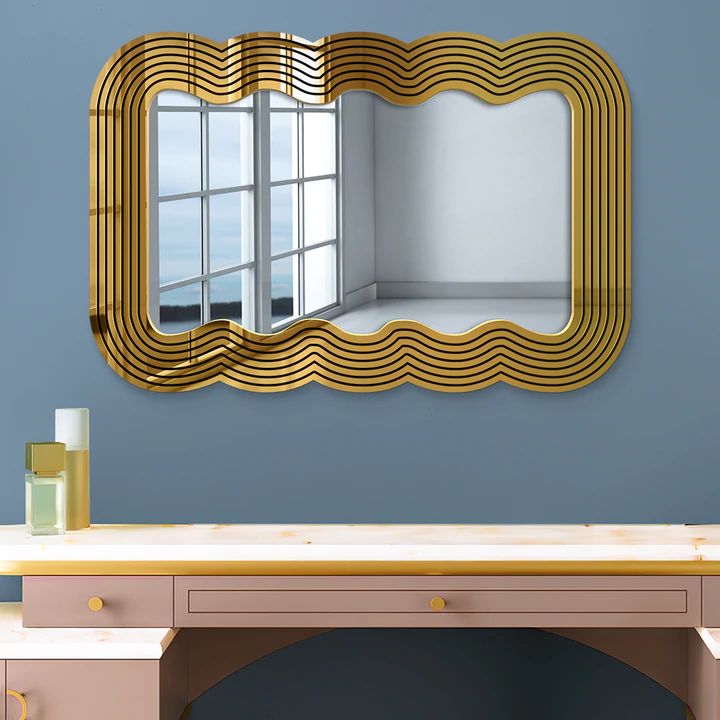 a mirror that is on the wall above a desk