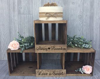 three tiered wooden boxes with flowers on them and the words, love is sweet