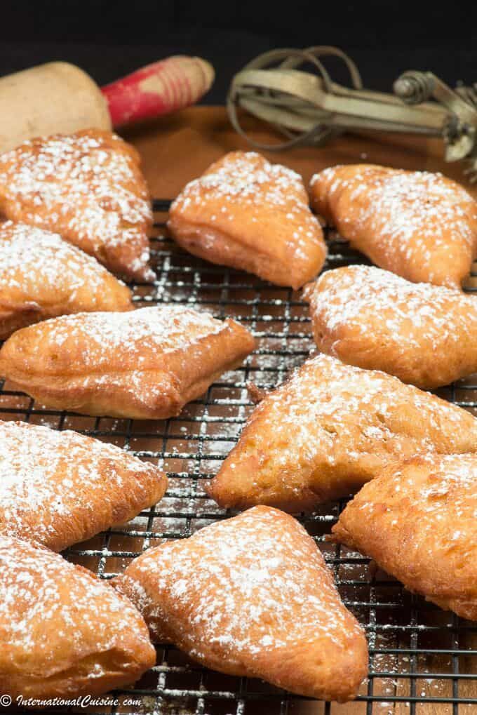 several pastries are cooling on a wire rack