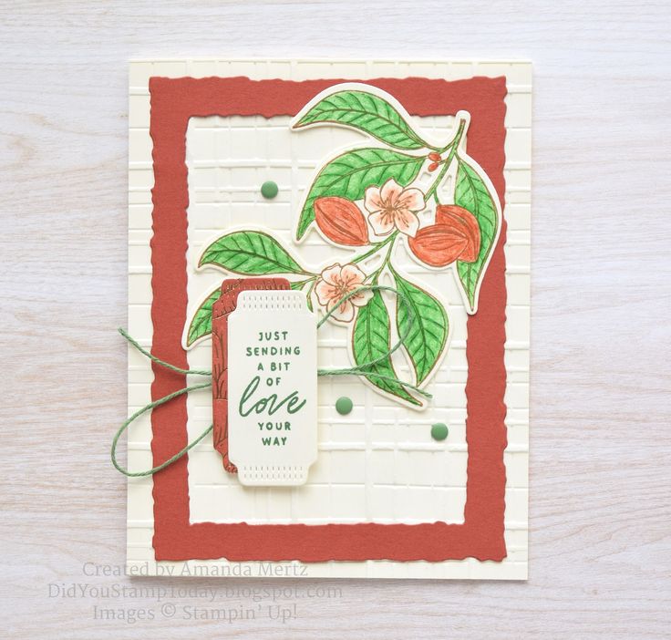 a close up of a card with flowers on it and a tag that says just sending love