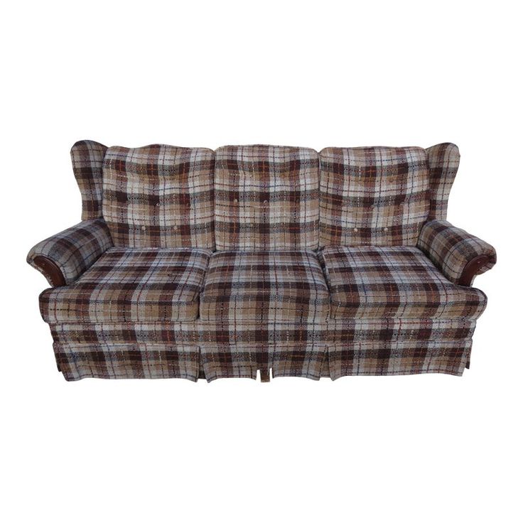 a brown and white plaid couch on a white background