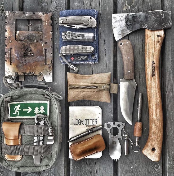 an assortment of tools laid out on top of a wooden table next to each other