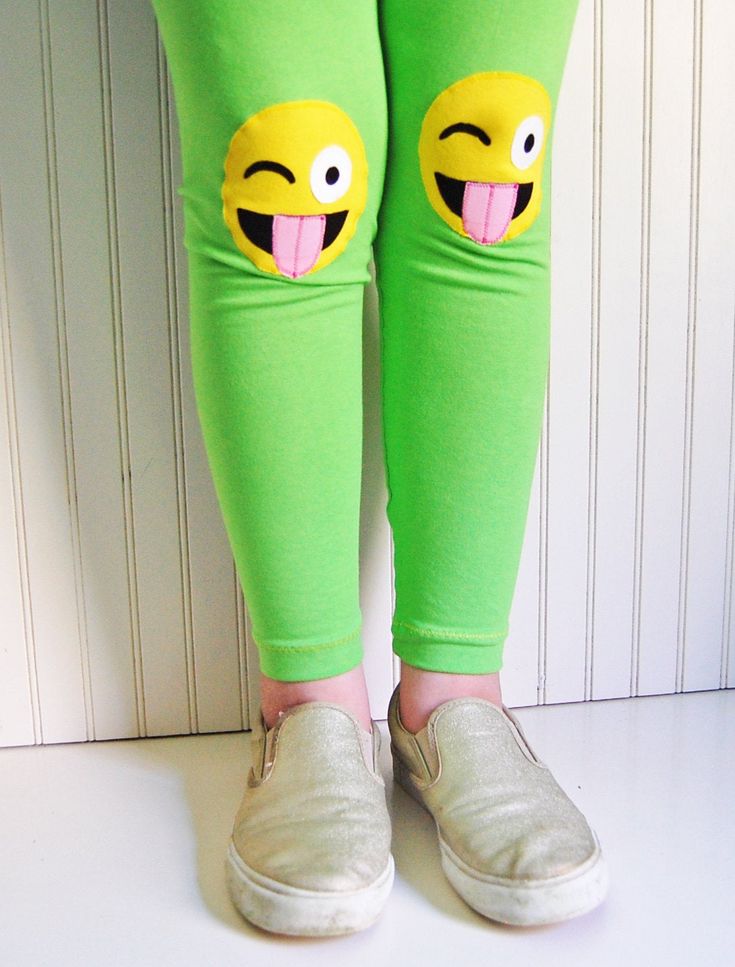 {DESCRIPTION} These fun and functional knee patch leggings are not only adorable, but they are made to last. Made with bright apple-green, medium-weight cotton lycra, these leggings are reinforced at the knees with yellow, crazy face emojis to protect your kiddo's delicate knees from playground wear and tear. Please note these leggings are handmade and some slight variation may occur. Leggings have an elastic non-roll waist band for a comfortable fit. Perfect for your emoji-obsessed kiddo! Meets Playful Elastic Bottoms For Spring, Playful Bottoms For School In Spring, Fun Cotton Bottoms For School, Cute Cotton Leggings For Spring, Fun Green Stretch Bottoms, Cute Green Cotton Bottoms, Playful Fitted Bottoms For School, Cute Stretch Pants For Spring, Stretch Cotton Fun Bottoms