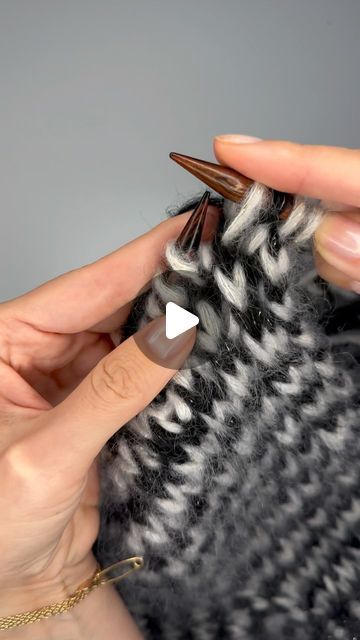 someone is crocheting the stitches on their fingernails to make it look like they are knitting