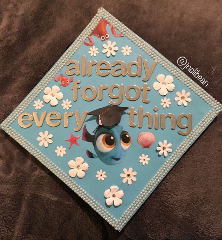 a blue graduation cap that says already forgot every thing with an owl and seashell on it