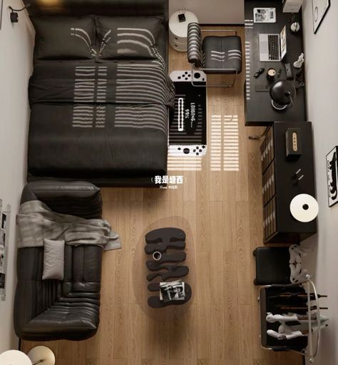 an overhead view of a living room with black furniture and accessories on the wood floor