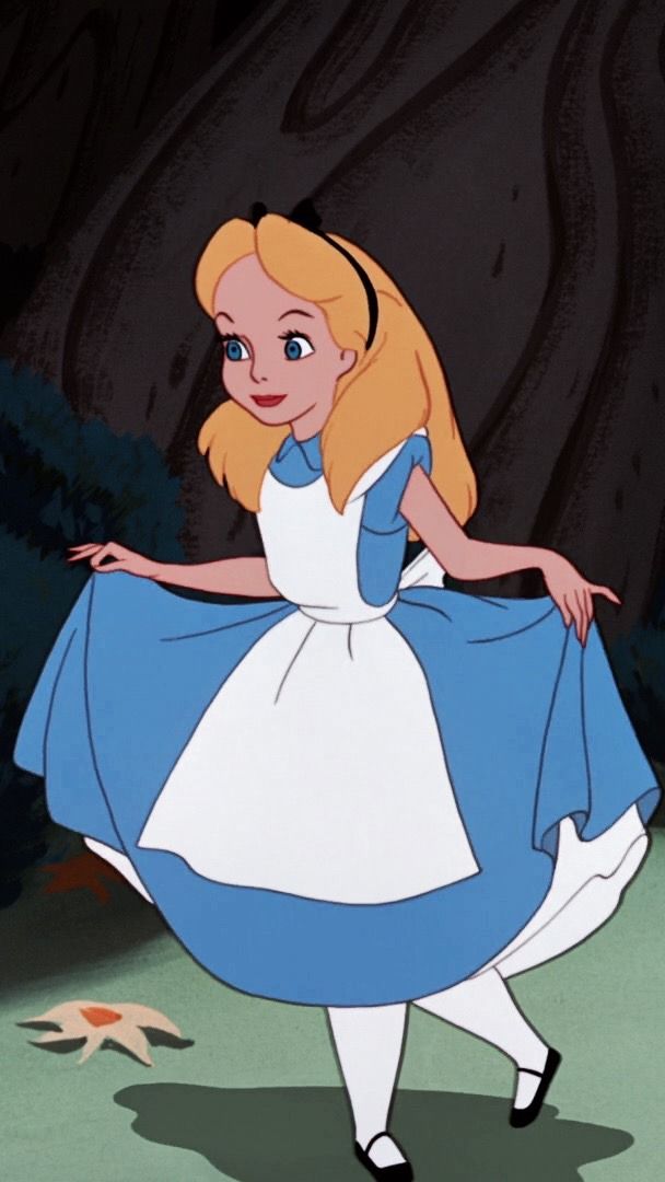 alice in blue and white dress standing next to a tree with her hand on the ground