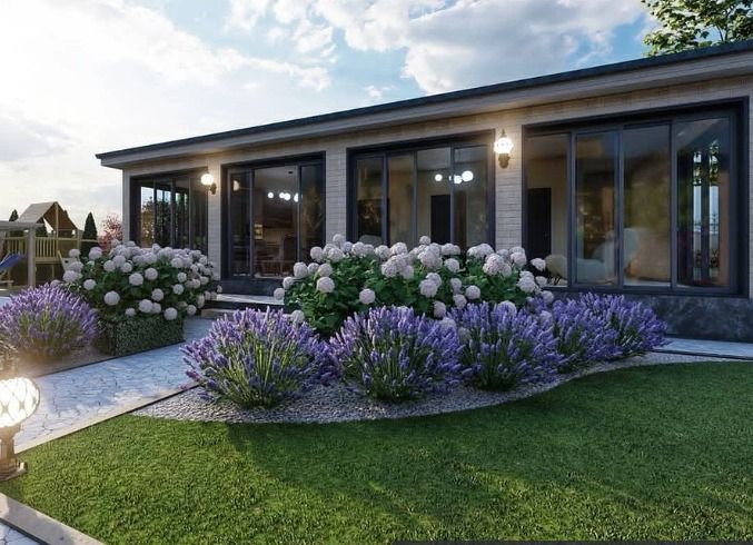 an artist's rendering of a house with flowers in the front and side yard