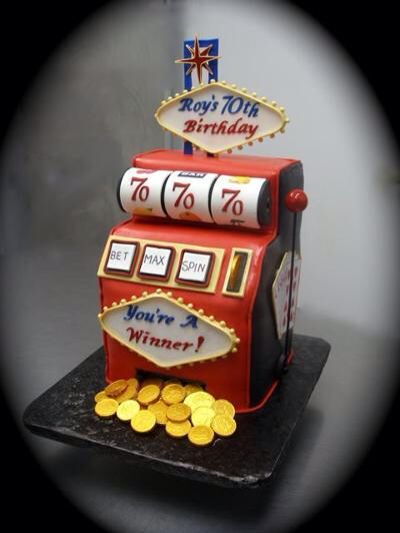 a cake made to look like a slot machine with gold coins around it and the words royal ten birthday written on top