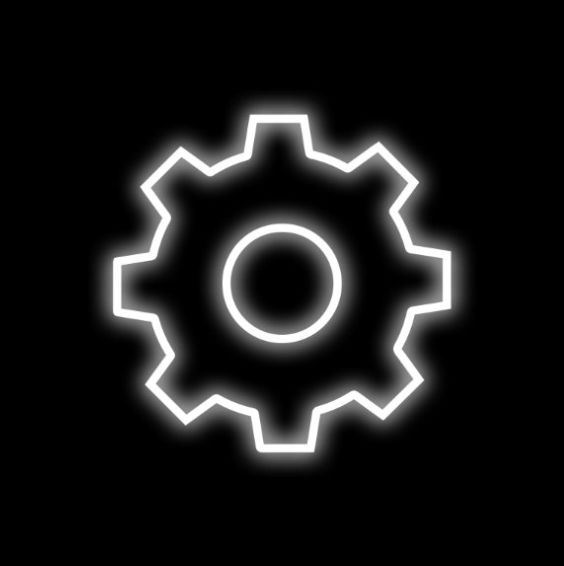 a white glowing gear wheel on a black background