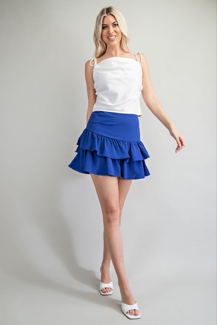 Ruffled Mini Skirt For Day Out, Chic Tiered Mini Skirt With Layered Hem, Chic Flowy Mini Skirt With Layered Hem, Flowy Ruffle Hem Skort In Mini Length, Flowy Mini Skort With Ruffles, Chic Mini Skirt With Layered Hem, Chic Relaxed Fit Mini Skirt With Ruffles, Blue Ruffled Skort, Ruffled Mini Skort For Day Out