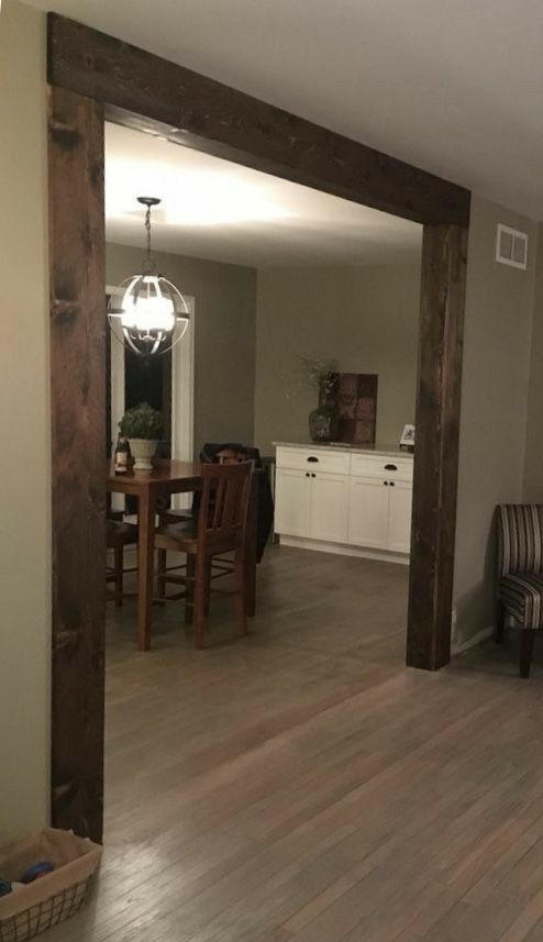 an open living room and dining room with wood floors